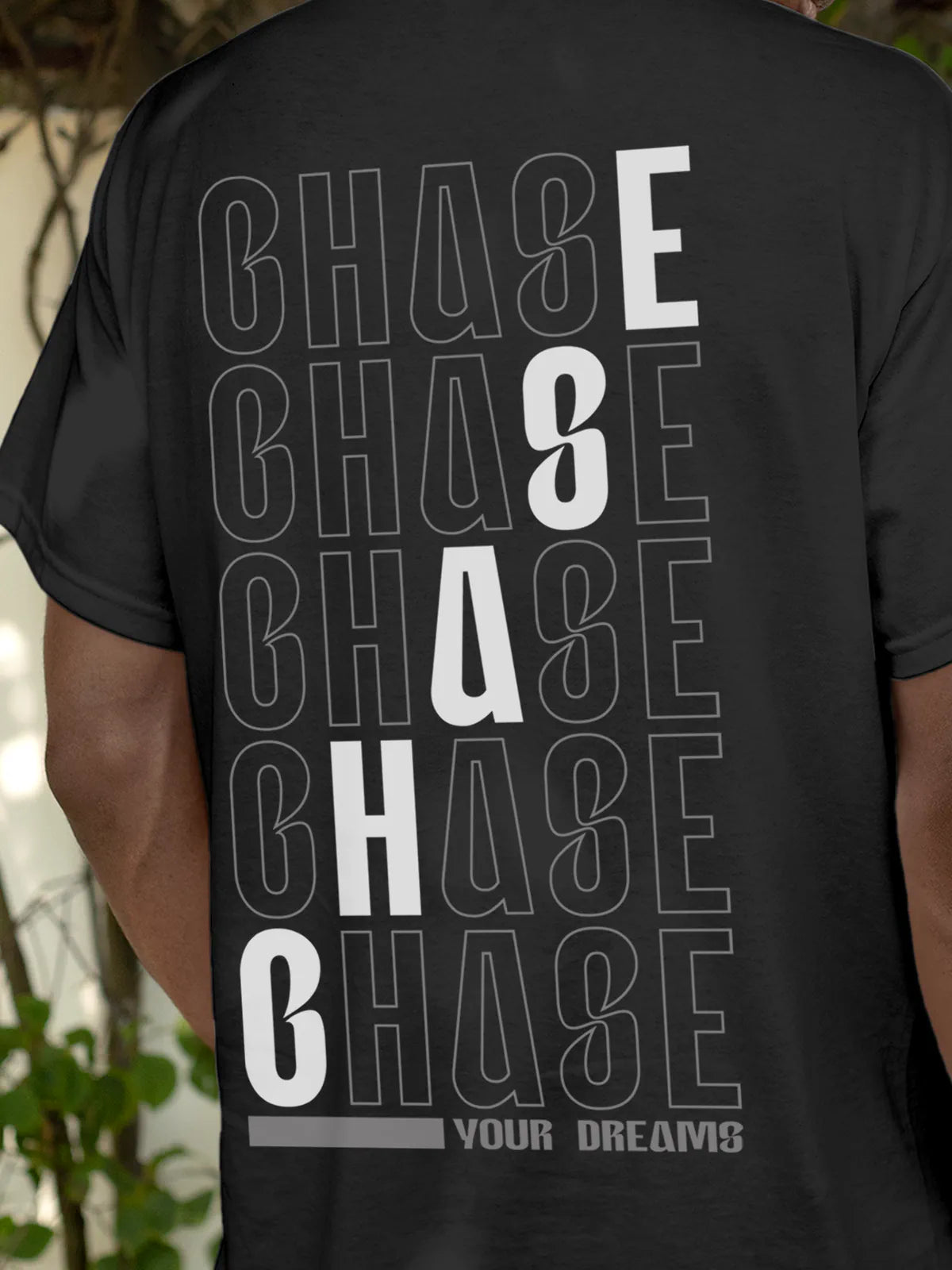 Close up of 'Chase Your Dreams' design on Men's Dark Grey Round Neck T-shirt, highlighting intricate details and vibrant print.