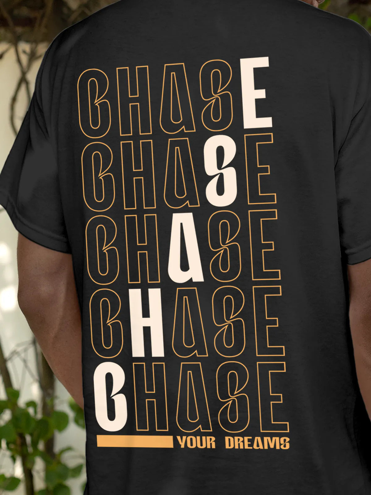 Close up of 'Chase Your Dreams' design on Men's Dark Grey Round Neck T-shirt, highlighting intricate details and vibrant print.