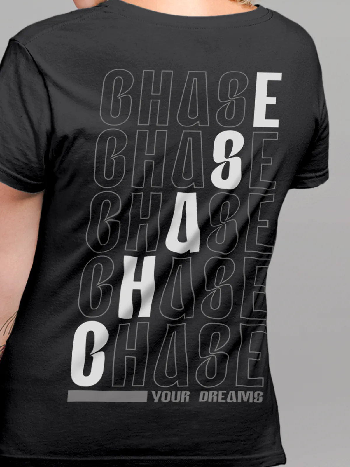 Close up of 'Chase Your Dreams' design on Women's Dark Grey Round Neck T-shirt, highlighting intricate details and vibrant print.
