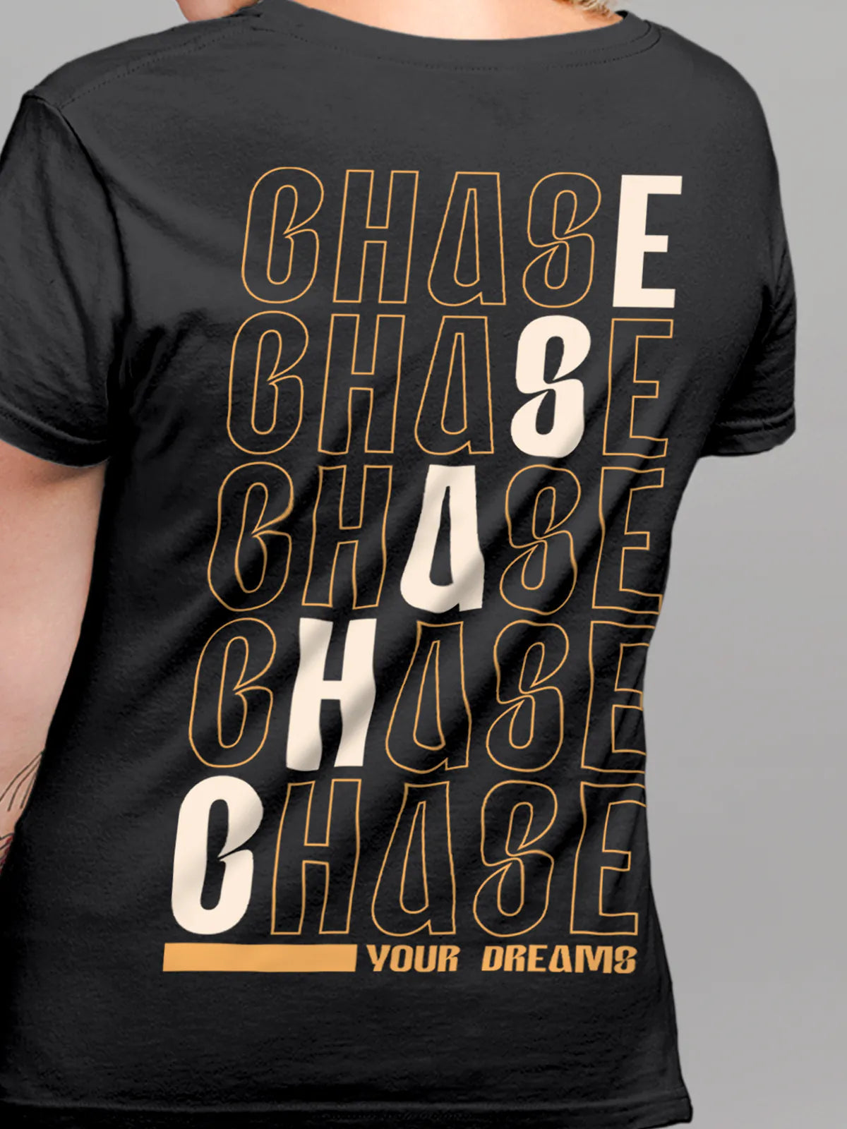 Close up of 'Chase Your Dreams' design on Women's Dark Grey Round Neck T-shirt, highlighting intricate details and vibrant print.
