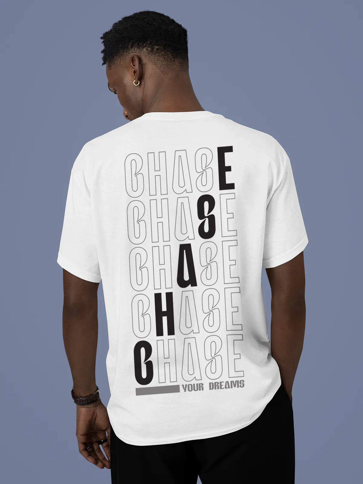Model wearing Men's White Round Neck T-shirt with 'Chase Your Dreams' design, offering effortless style and premium comfort