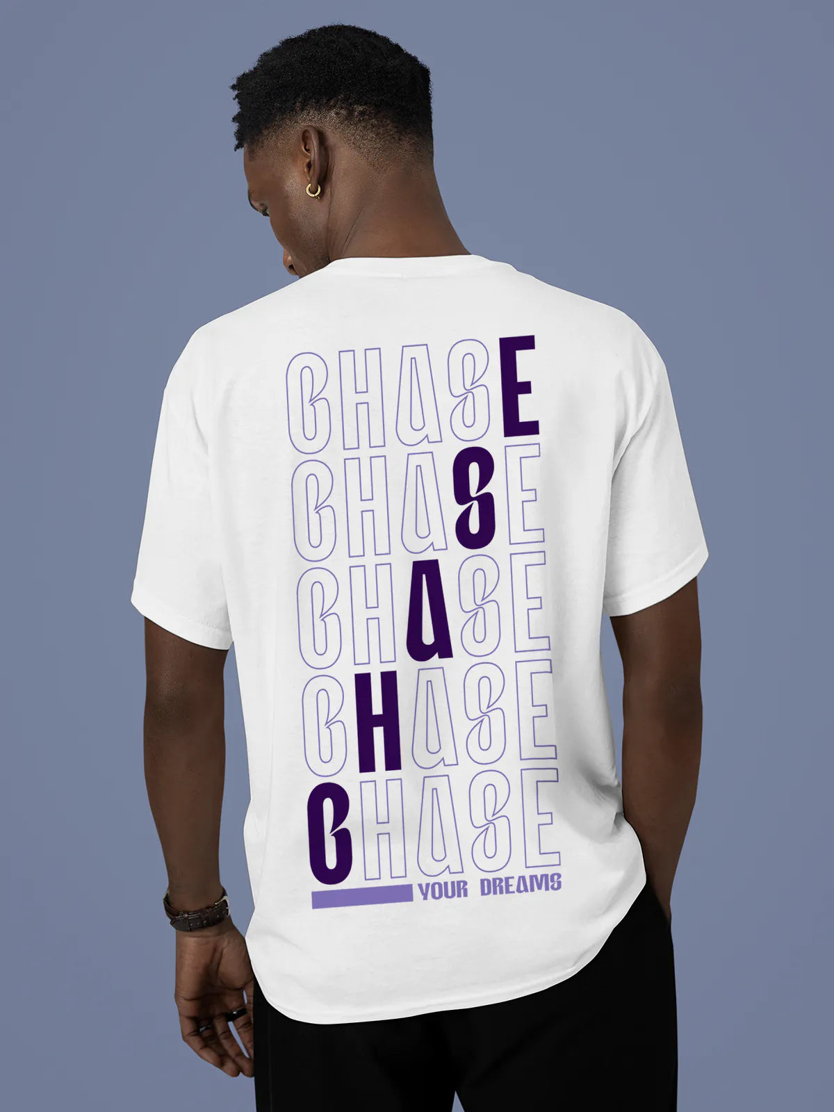 Model wearing Men's White Round Neck T-shirt with 'Chase Your Dreams' design, offering effortless style and premium comfort
