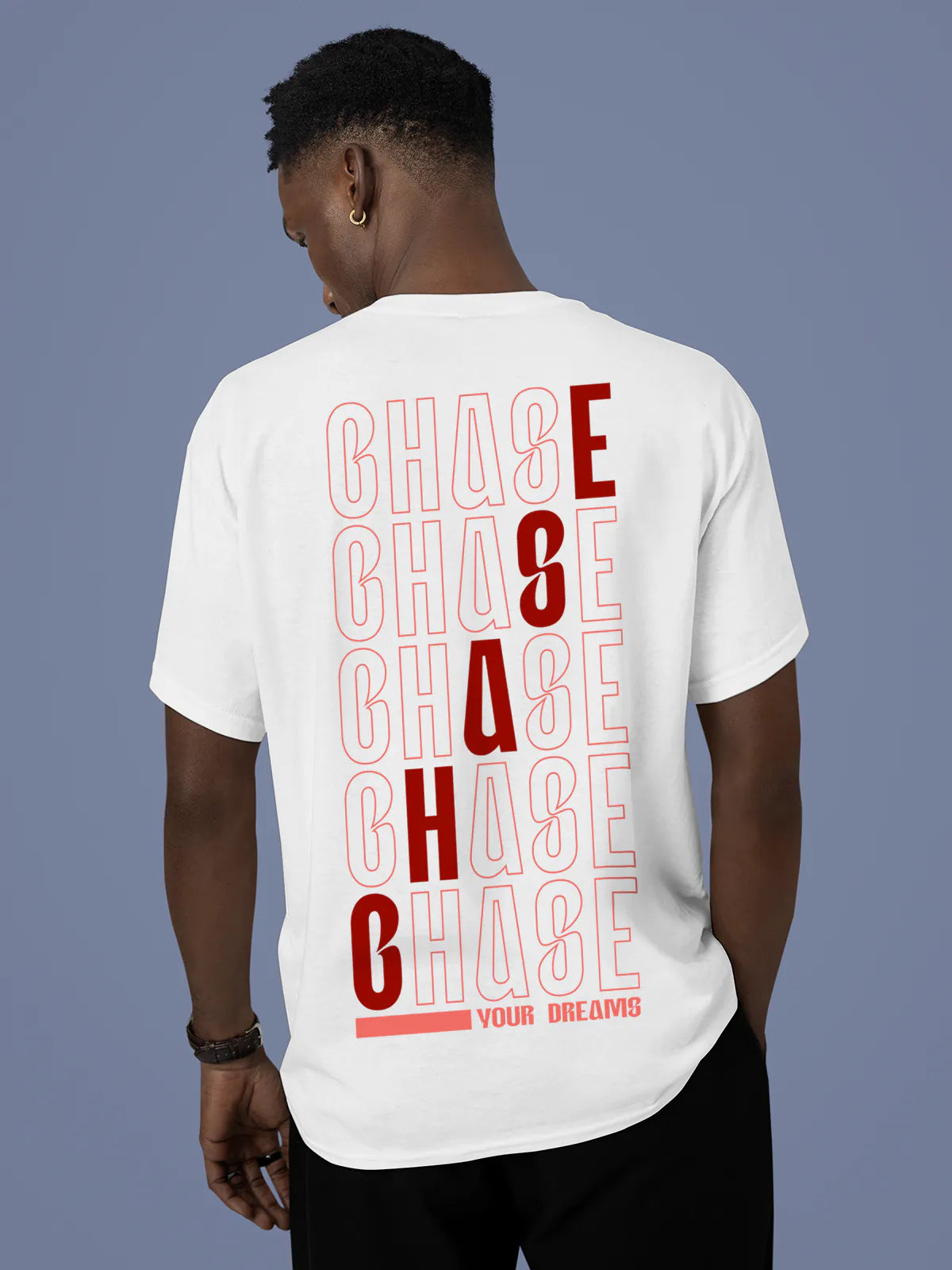 Model wearing Men's White Round Neck T-shirt with 'Chase Your Dreams' design, offering effortless style and premium comfort