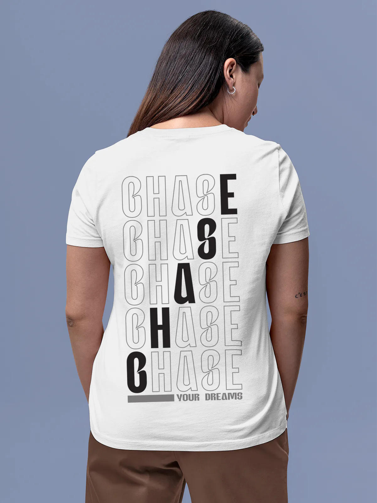 Model wearing Women's White Round Neck T-shirt with 'Chase Your Dreams' design, offering effortless style and premium comfort