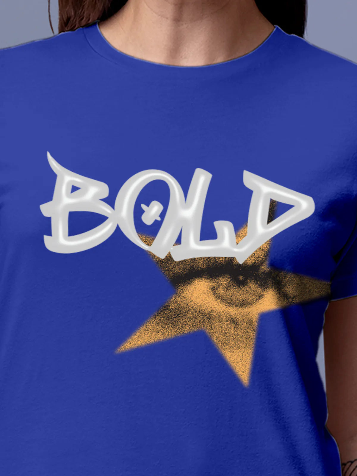 Close up of 'Bold' design on Women's Blue Round Neck T-shirt, highlighting intricate details and vibrant print.