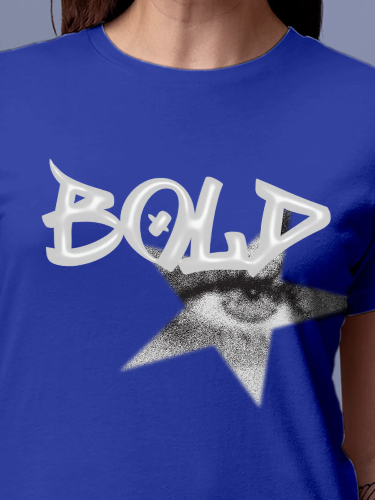 Close up of 'Bold' design on Women's Blue Round Neck T-shirt, highlighting intricate details and vibrant print.