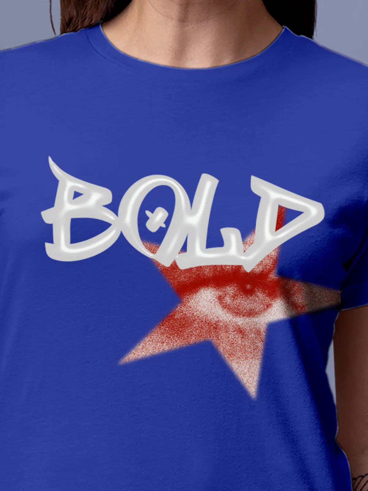 Close up of 'Bold' design on Women's Blue Round Neck T-shirt, highlighting intricate details and vibrant print.