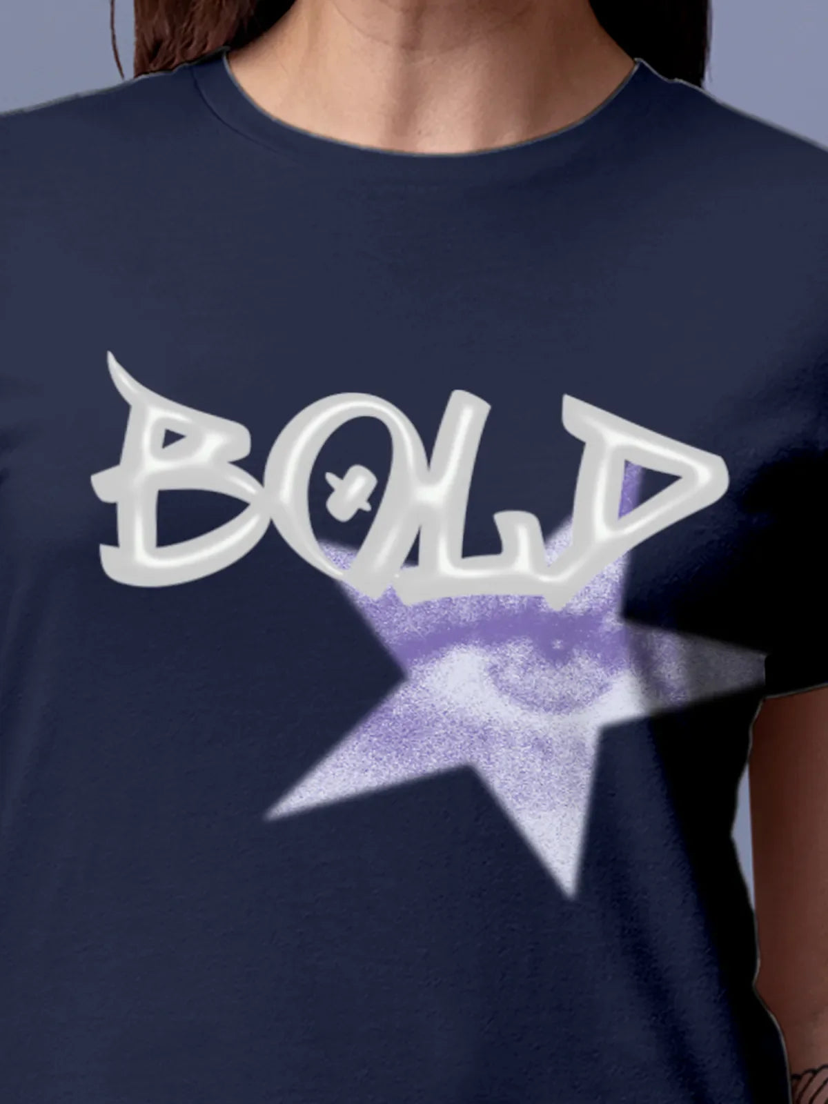 Close up of 'Bold' design on Women's Navy Blue Round Neck T-shirt, highlighting intricate details and vibrant print.