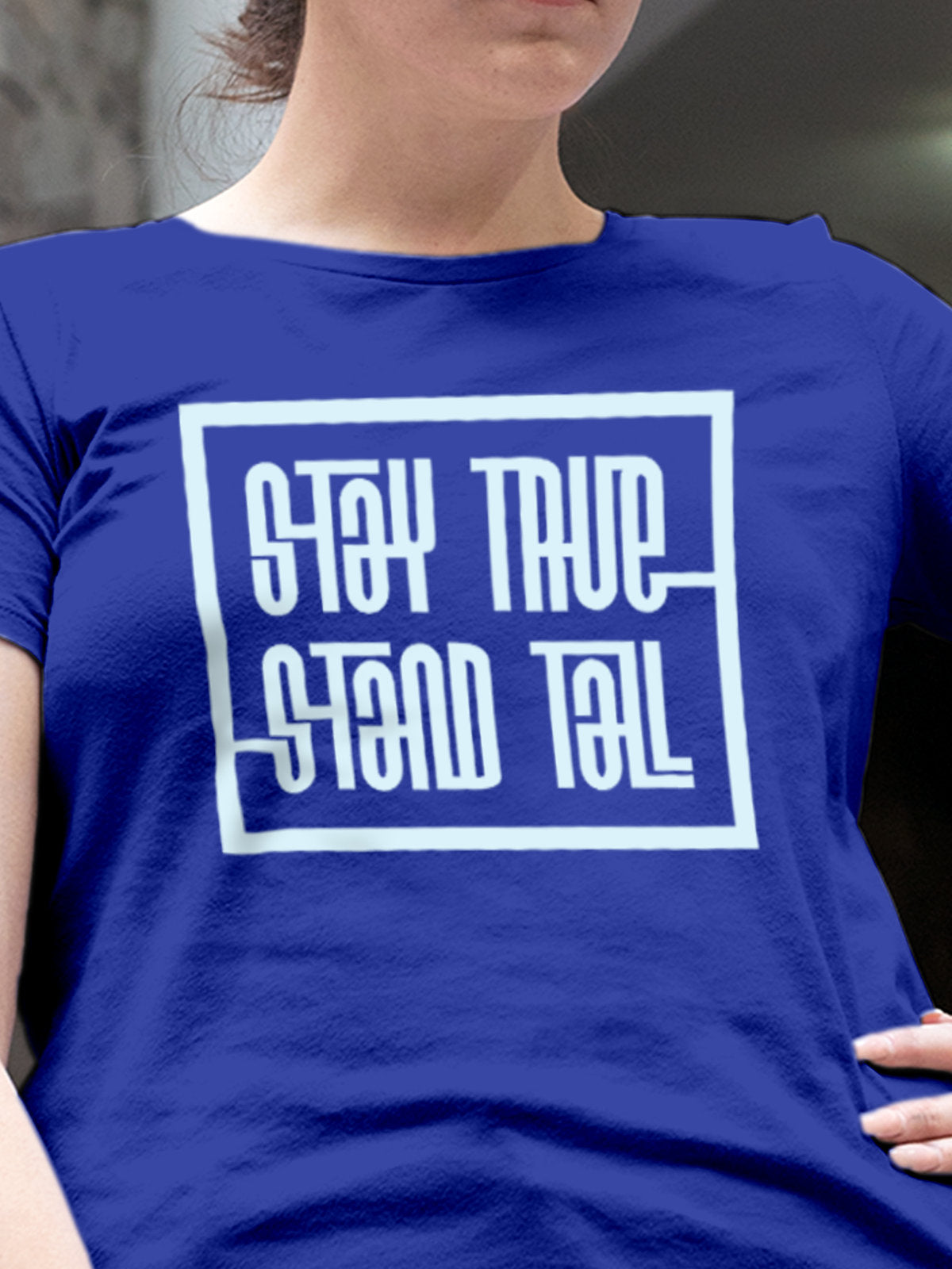 Close up of 'Stay True Stand Tall' design on Women's Blue Round Neck T-shirt, highlighting intricate details and vibrant print.