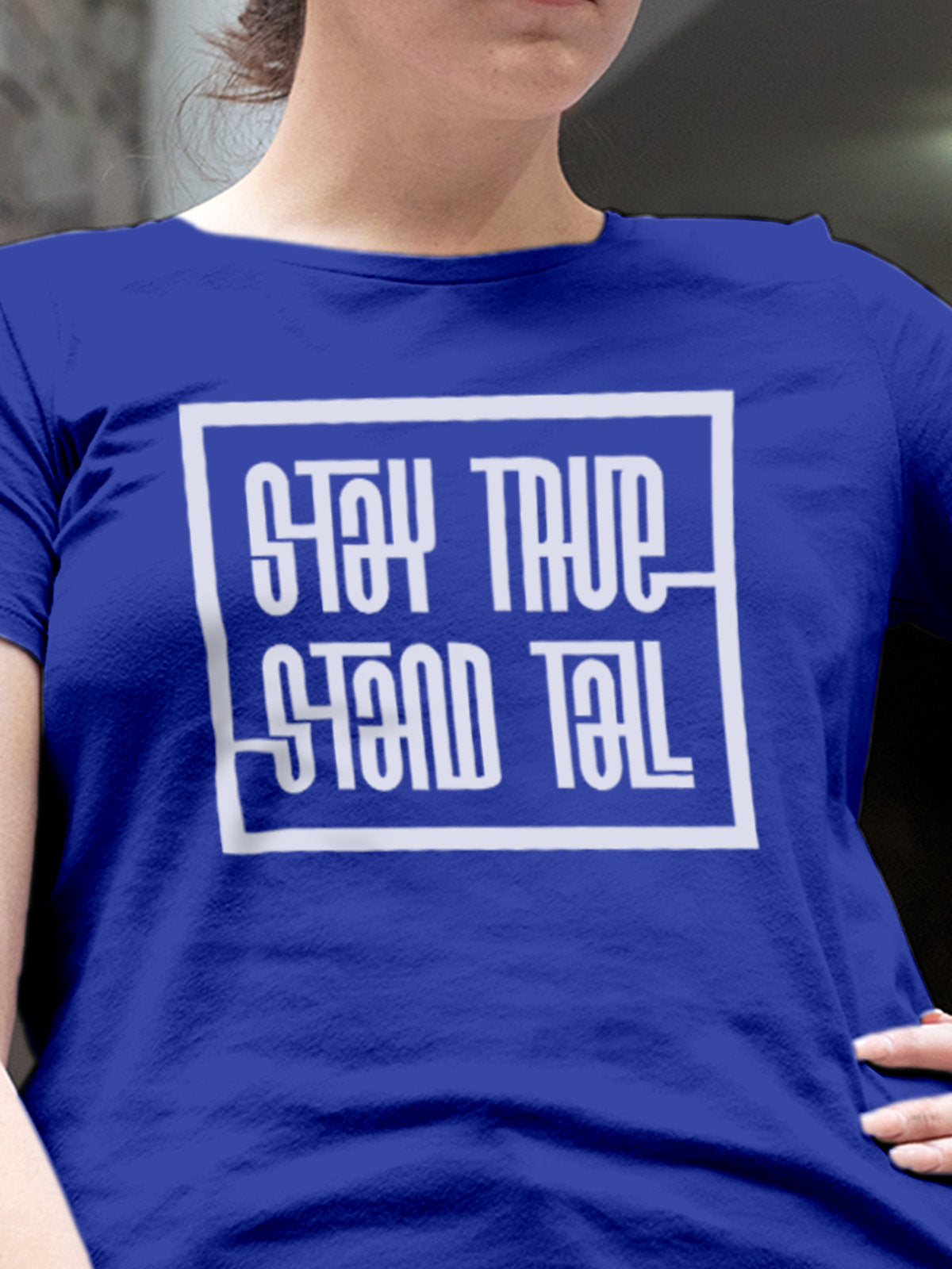 Close up of 'Stay True Stand Tall' design on Women's Blue Round Neck T-shirt, highlighting intricate details and vibrant print.