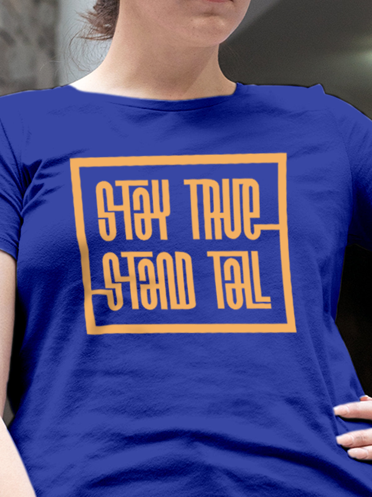 Close up of 'Stay True Stand Tall' design on Women's Blue Round Neck T-shirt, highlighting intricate details and vibrant print.