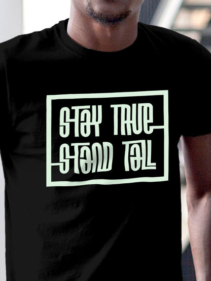 Close up of 'Stay True Stand Tall' design on Men's Black Round Neck T-shirt, highlighting intricate details and vibrant print.