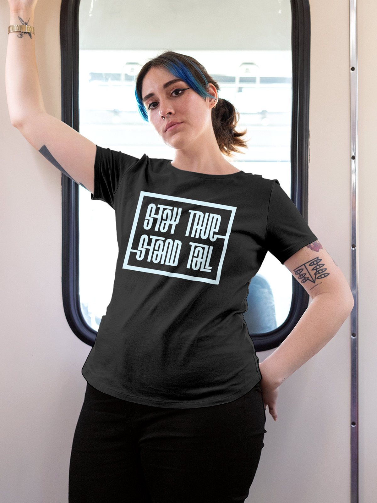 Model wearing Women's Dark Grey Round Neck T-shirt with 'Stay True Stand Tall' design, offering effortless style and premium comfort