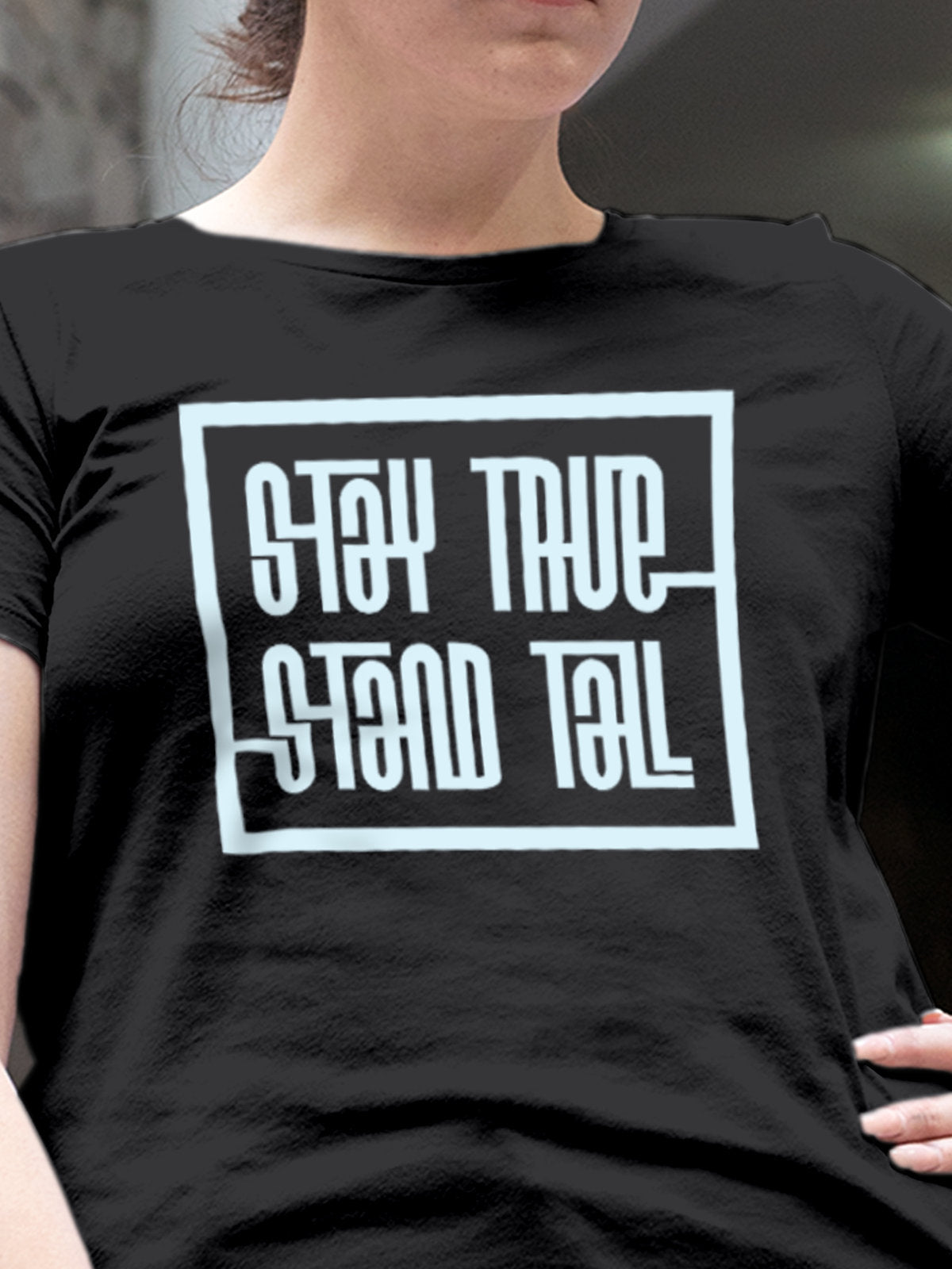 Close up of 'Stay True Stand Tall' design on Women's Dark Grey Round Neck T-shirt, highlighting intricate details and vibrant print.