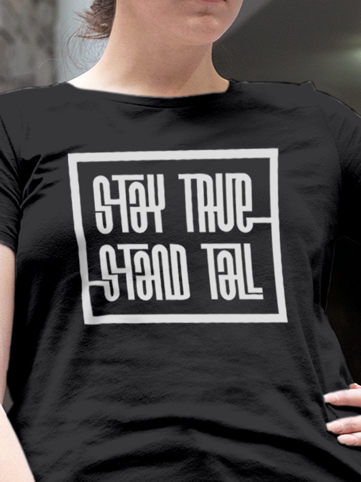 Close up of 'Stay True Stand Tall' design on Women's Dark Grey Round Neck T-shirt, highlighting intricate details and vibrant print.