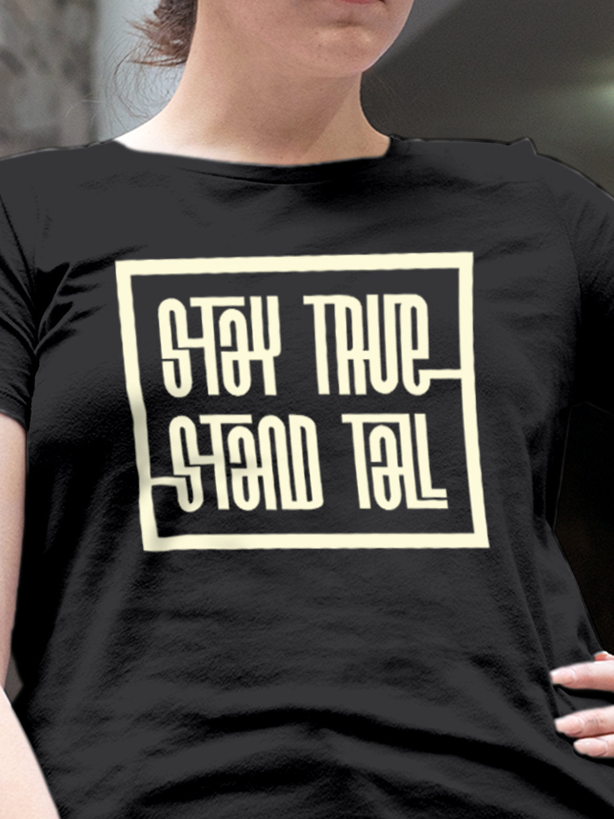 Close up of 'Stay True Stand Tall' design on Women's Dark Grey Round Neck T-shirt, highlighting intricate details and vibrant print.