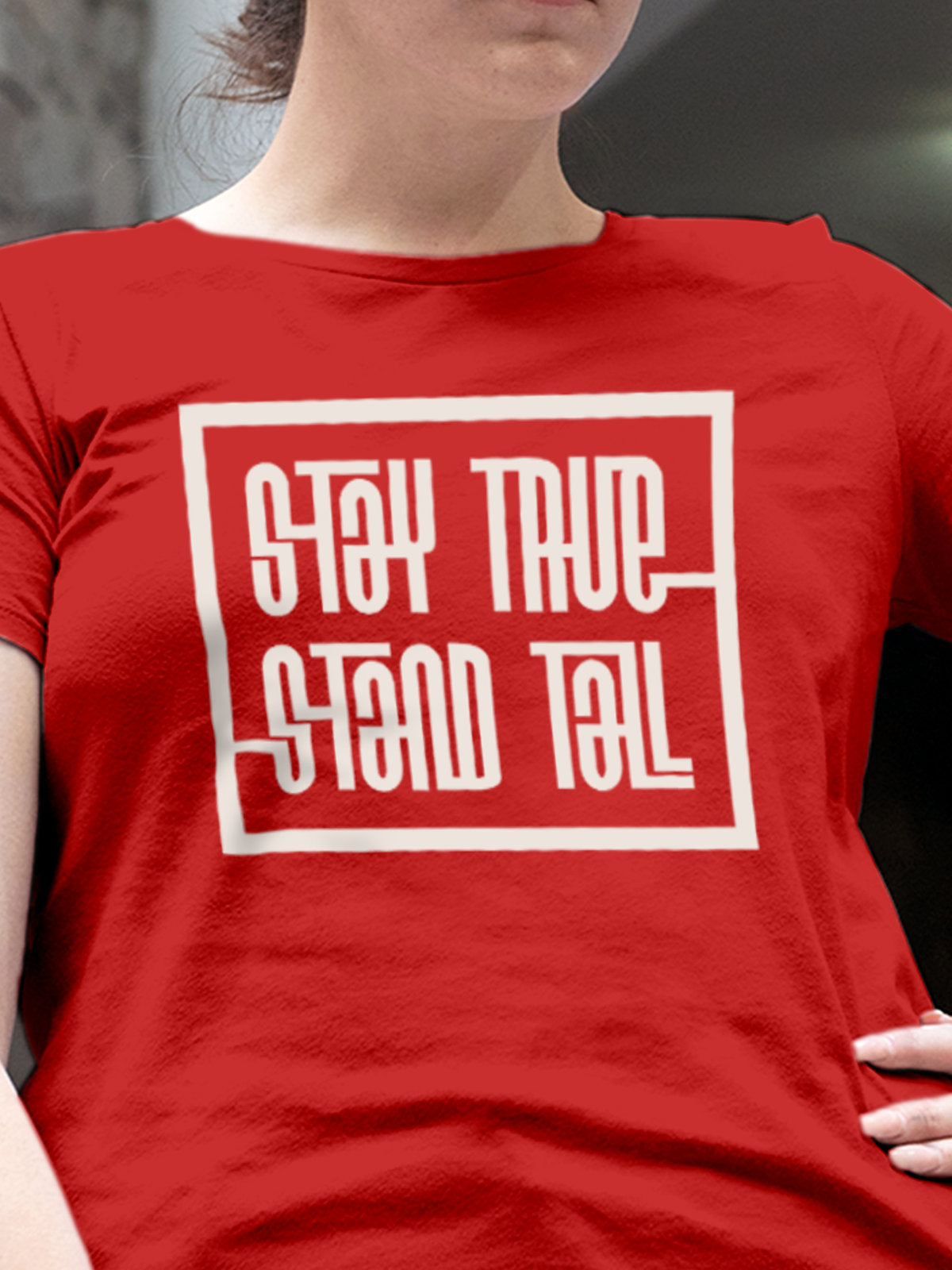 Close up of 'Stay True Stand Tall' design on Women's Red Round Neck T-shirt, highlighting intricate details and vibrant print.