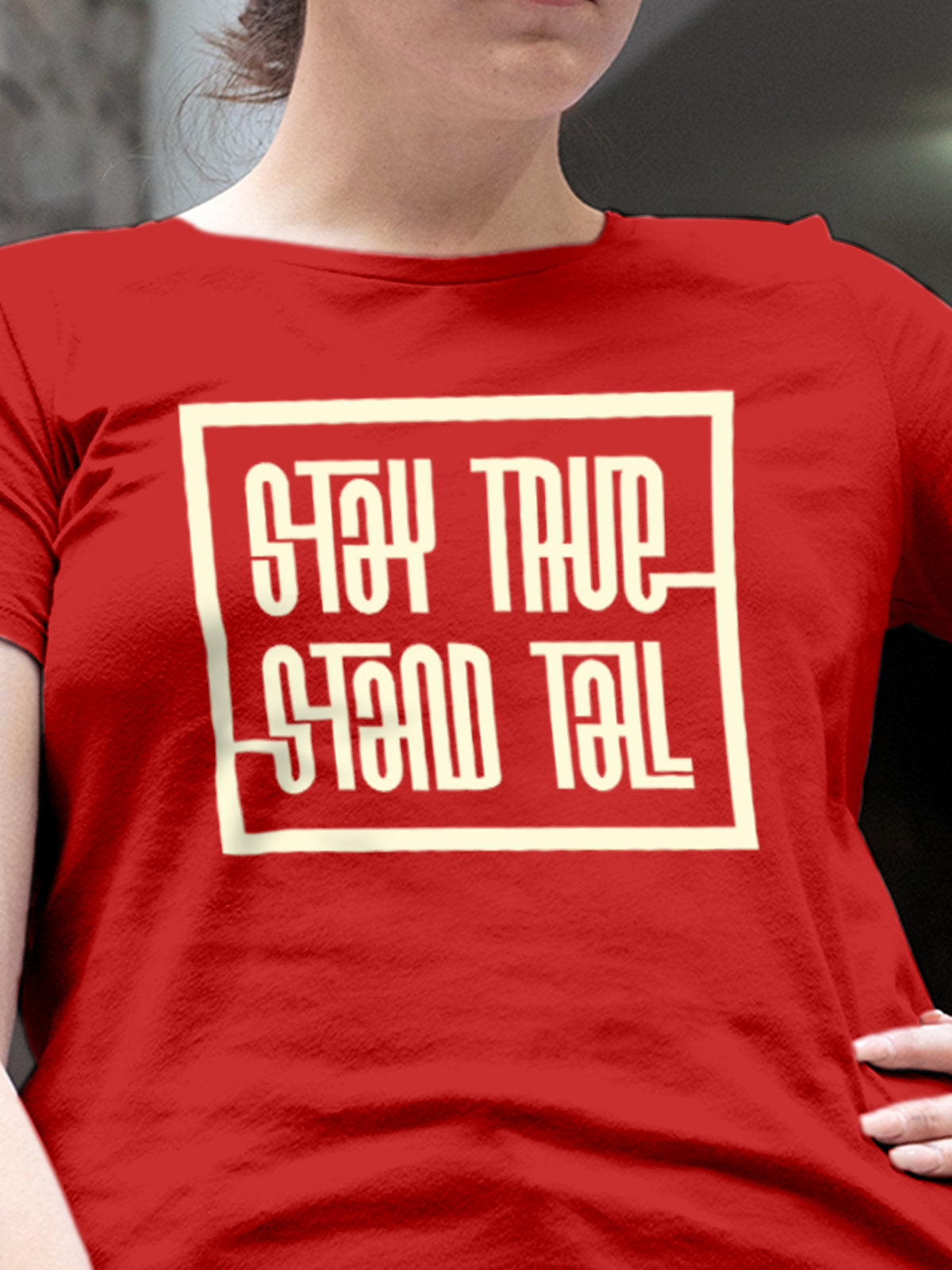 Close up of 'Stay True Stand Tall' design on Women's Red Round Neck T-shirt, highlighting intricate details and vibrant print.