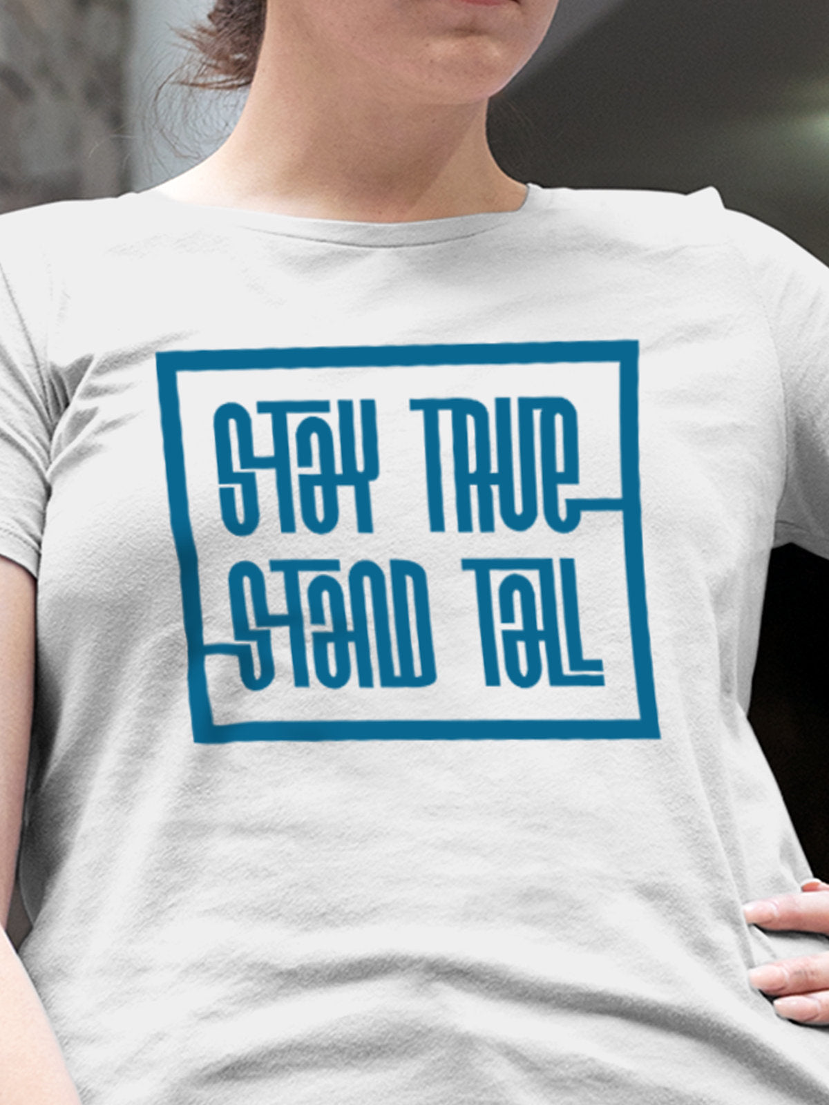 Close up of 'Stay True Stand Tall' design on Women's White Round Neck T-shirt, highlighting intricate details and vibrant print.