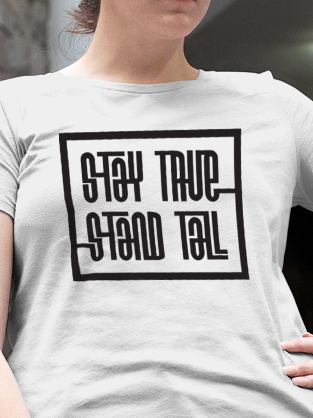 Close up of 'Stay True Stand Tall' design on Women's White Round Neck T-shirt, highlighting intricate details and vibrant print.