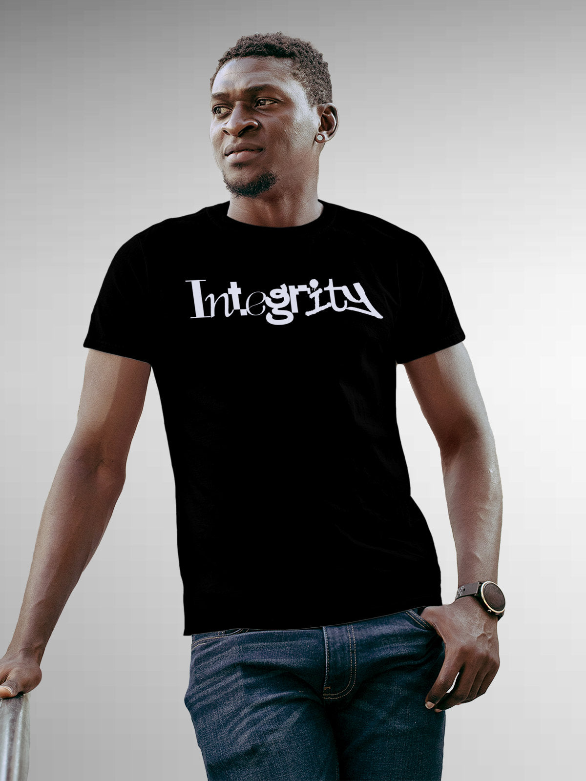 Model wearing Men's Black Round Neck T-shirt with 'Integrity' design, offering effortless style and premium comfort
