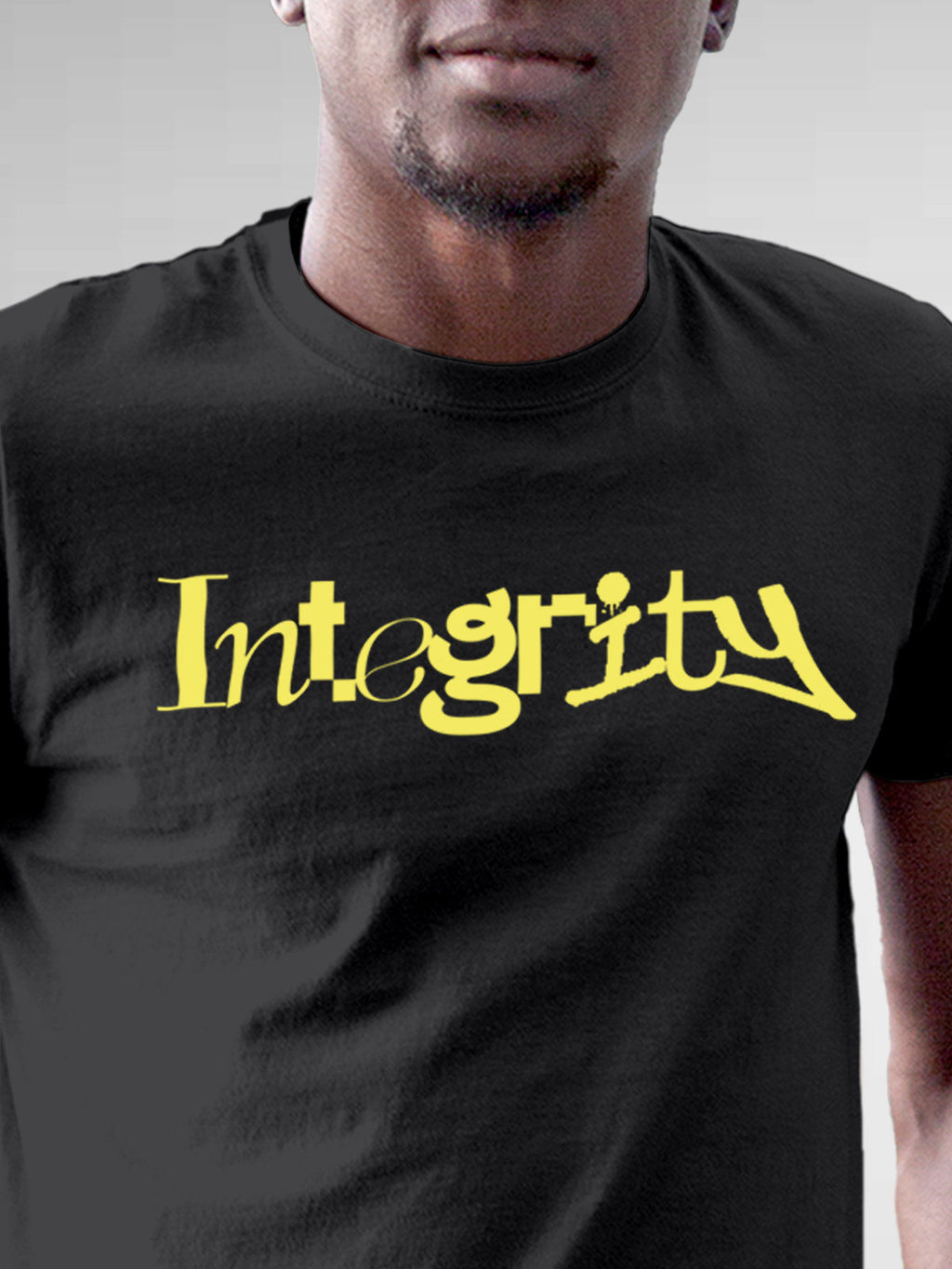 Close up of 'Integrity' design on Men's Dark Grey Round Neck T-shirt, highlighting intricate details and vibrant print.