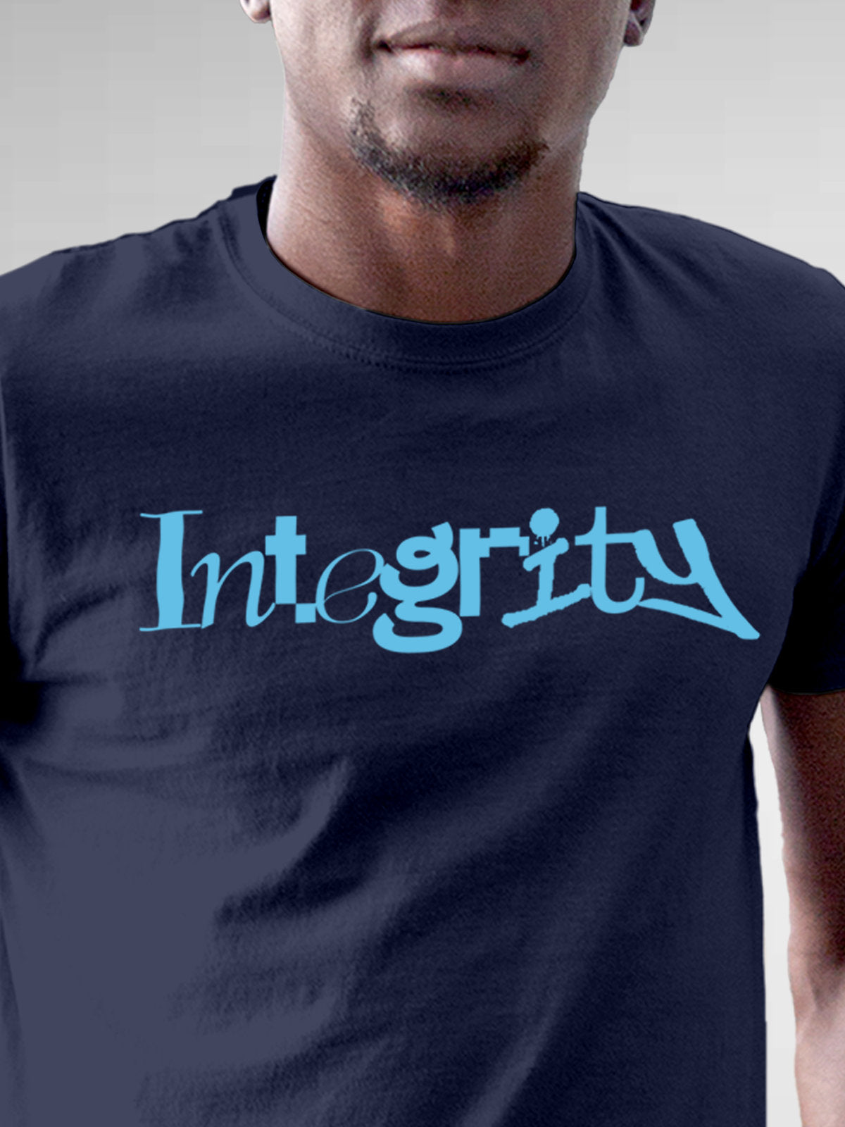 Close up of 'Integrity' design on Men's Navy Blue Round Neck T-shirt, highlighting intricate details and vibrant print.