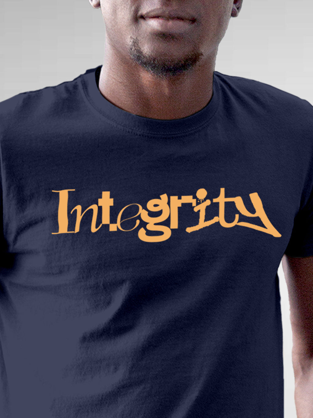 Close up of 'Integrity' design on Men's Navy Blue Round Neck T-shirt, highlighting intricate details and vibrant print.