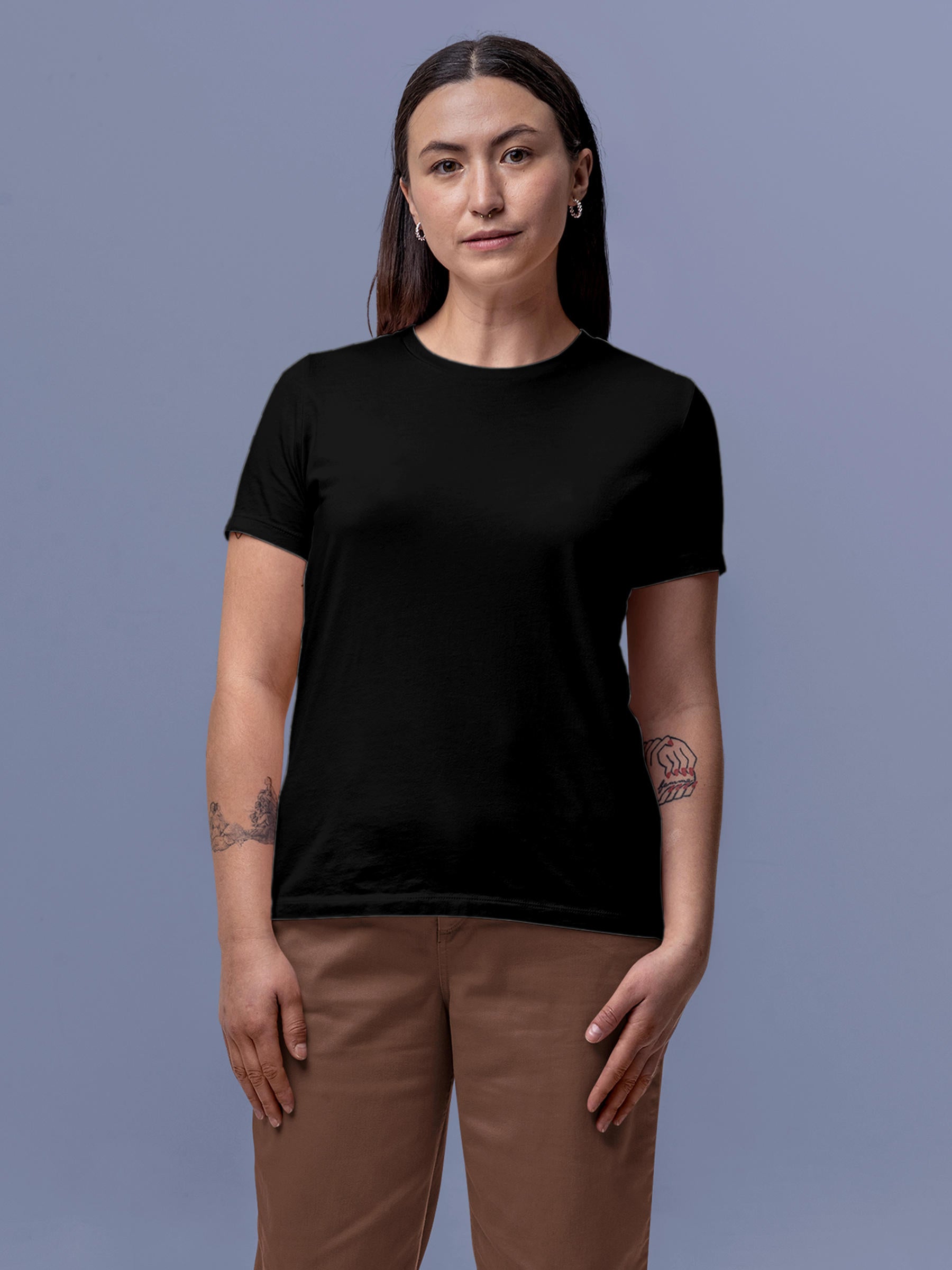 Model wearing Women's Black Round Neck Plain Solid T-shirt, offering effortless style and premium comfort