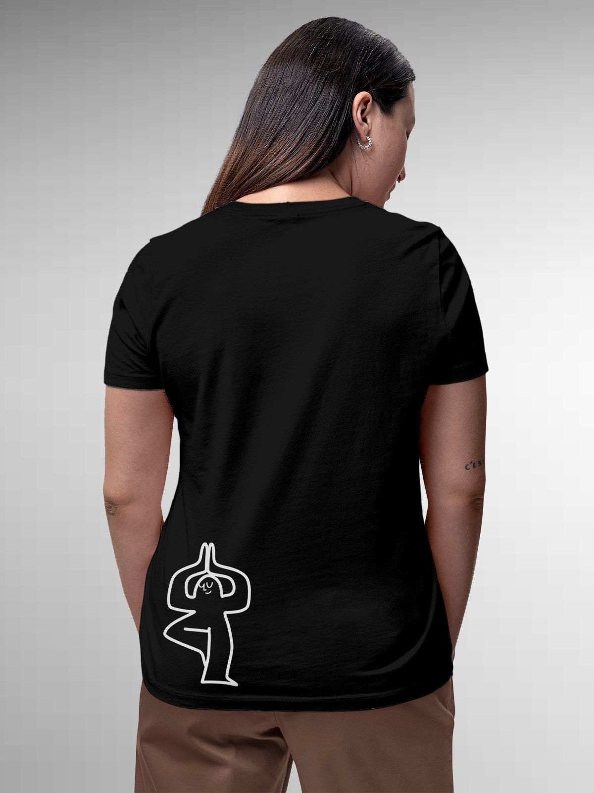 Model wearing Women's Black Round Neck T-shirt with 'Balance Is A Decision' design, offering effortless style and premium comfort