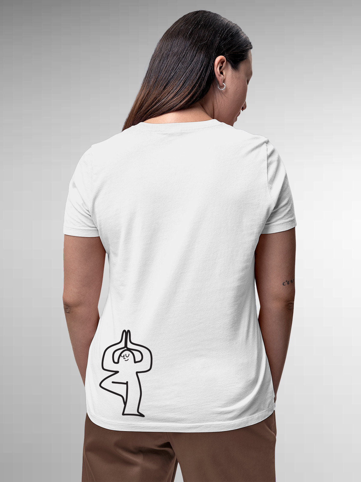 Model wearing Women's White Round Neck T-shirt with 'Balance Is A Decision' design, offering effortless style and premium comfort