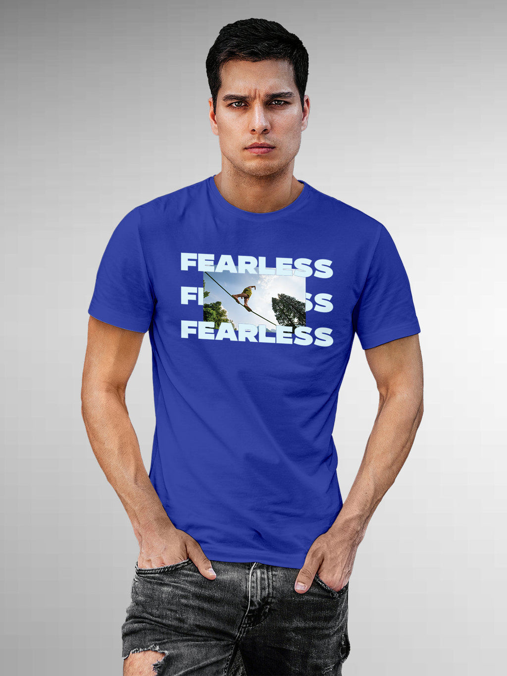 Model wearing Men's Blue Round Neck T-shirt with 'Fearless' design, offering effortless style and premium comfort