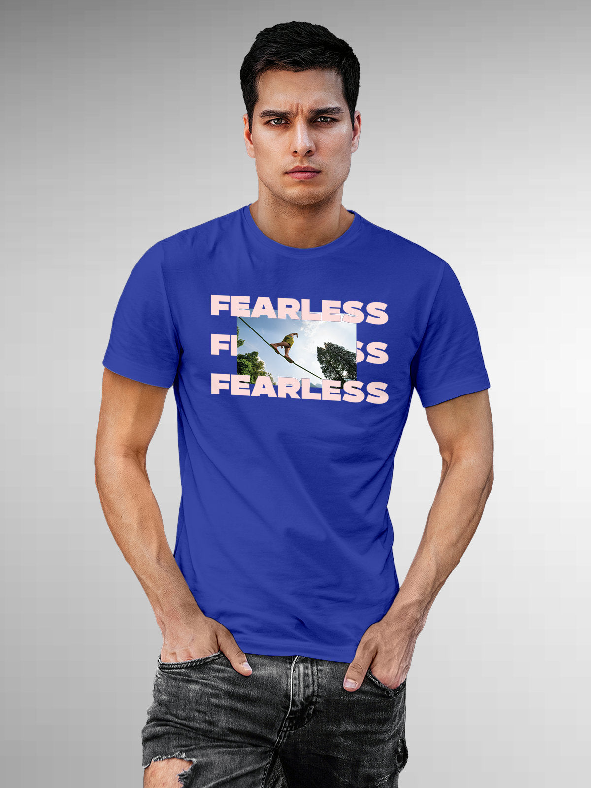 Model wearing Men's Blue Round Neck T-shirt with 'Fearless' design, offering effortless style and premium comfort