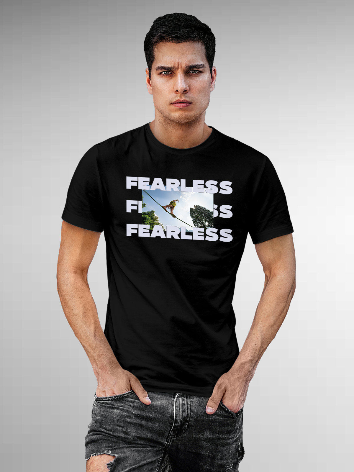 Model wearing Men's Black Round Neck T-shirt with 'Fearless' design, offering effortless style and premium comfort