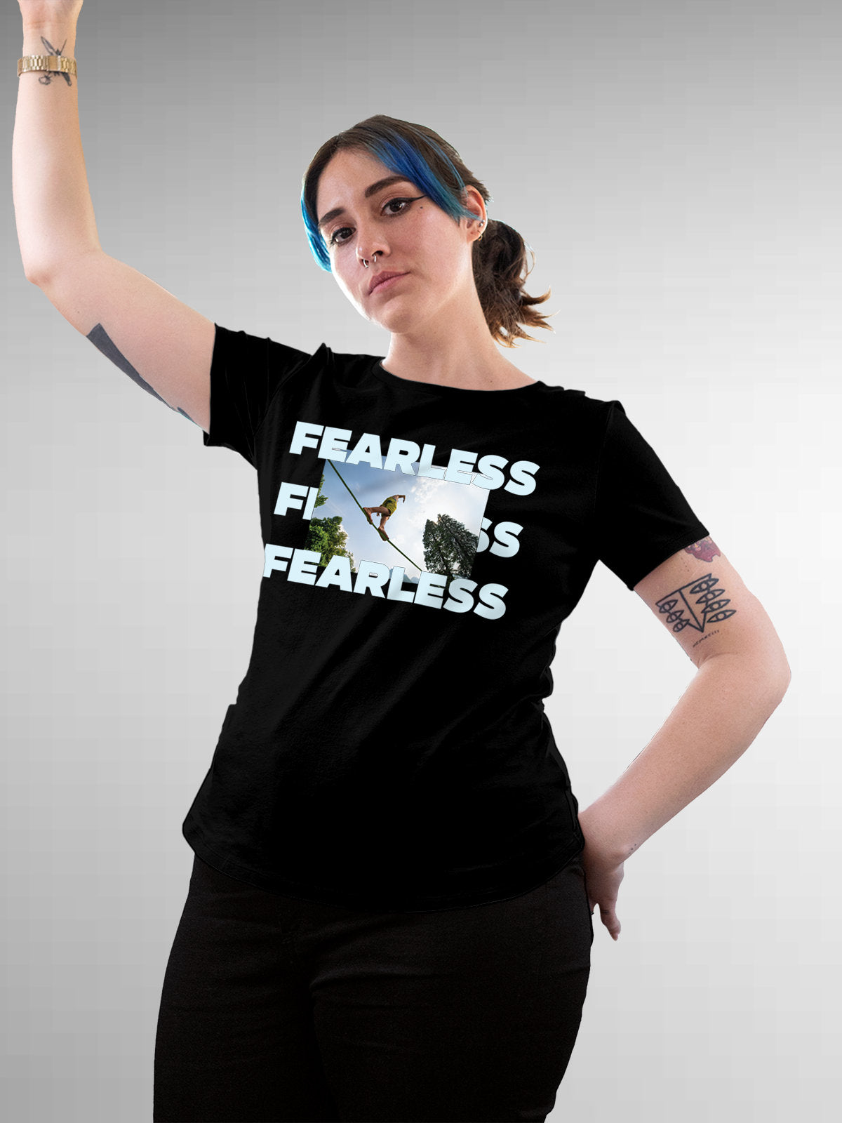 Model wearing Women's Black Round Neck T-shirt with 'Fearless' design, offering effortless style and premium comfort
