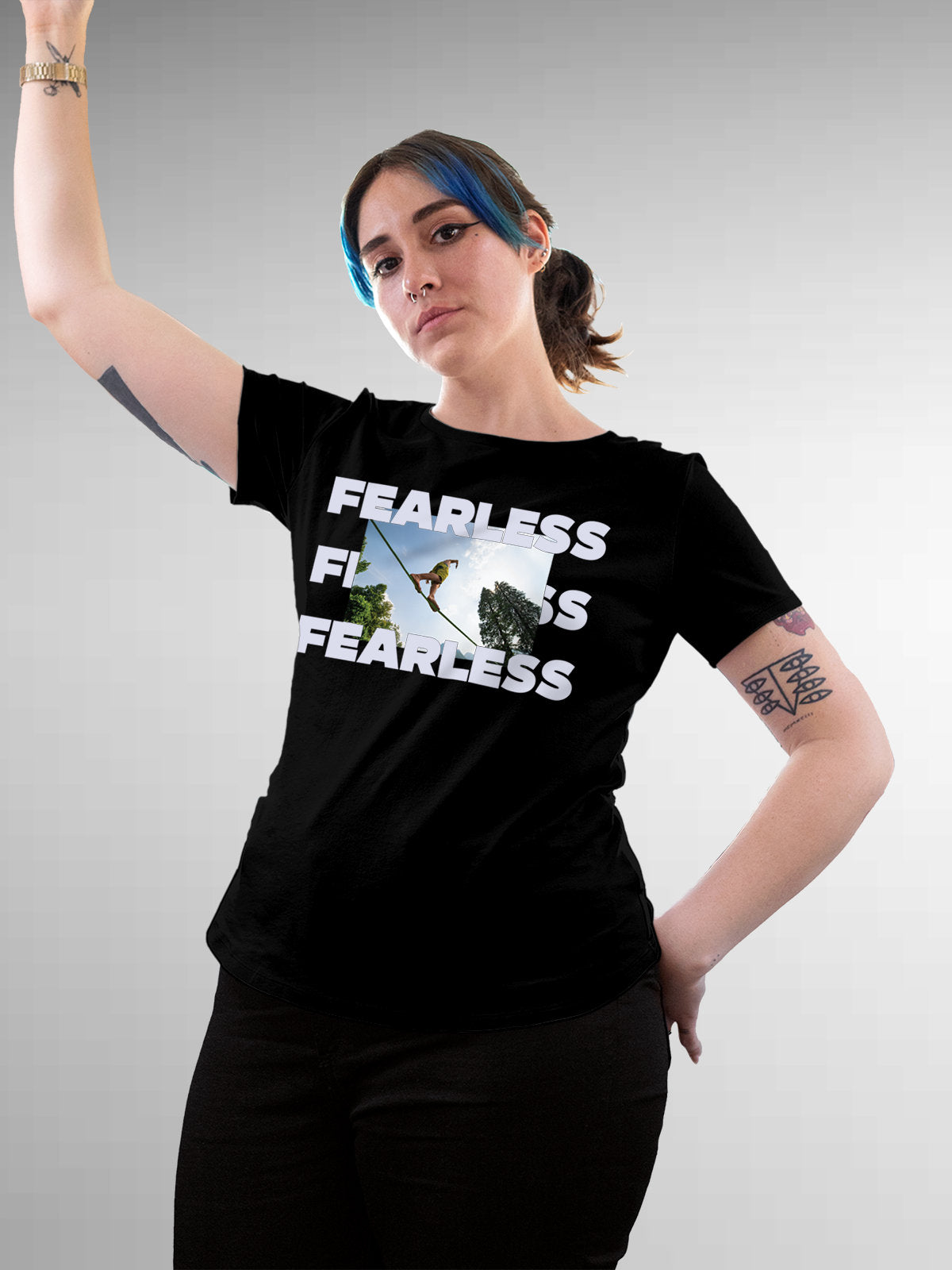 Model wearing Women's Black Round Neck T-shirt with 'Fearless' design, offering effortless style and premium comfort