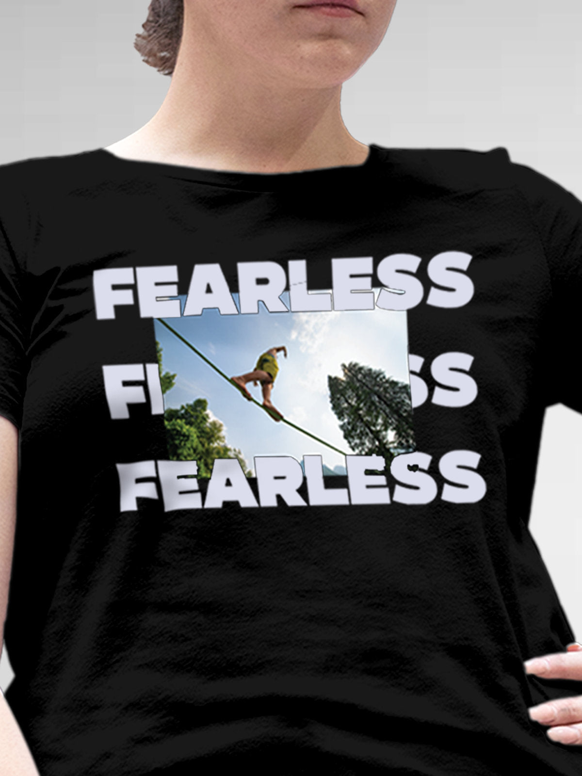 Close up of 'Fearless' design on Women's Black Round Neck T-shirt, highlighting intricate details and vibrant print.
