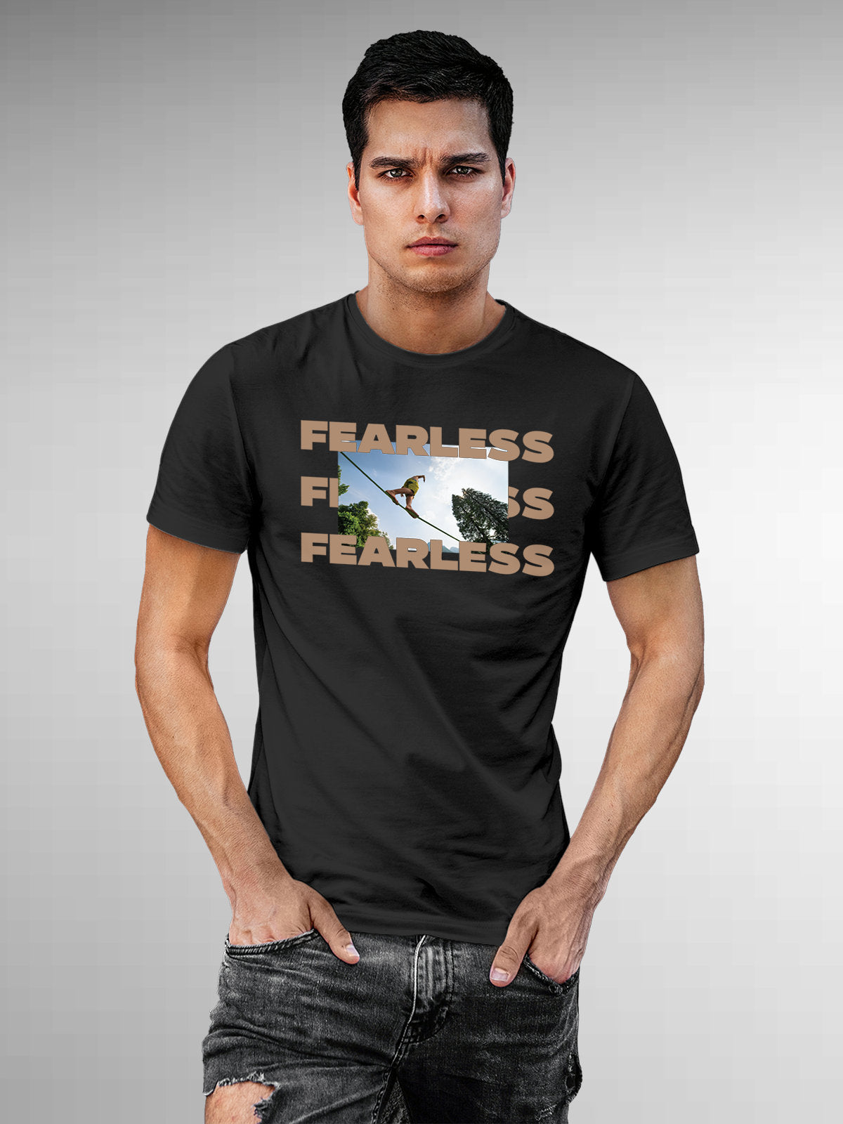 Model wearing Men's Dark Grey Round Neck T-shirt with 'Fearless' design, offering effortless style and premium comfort