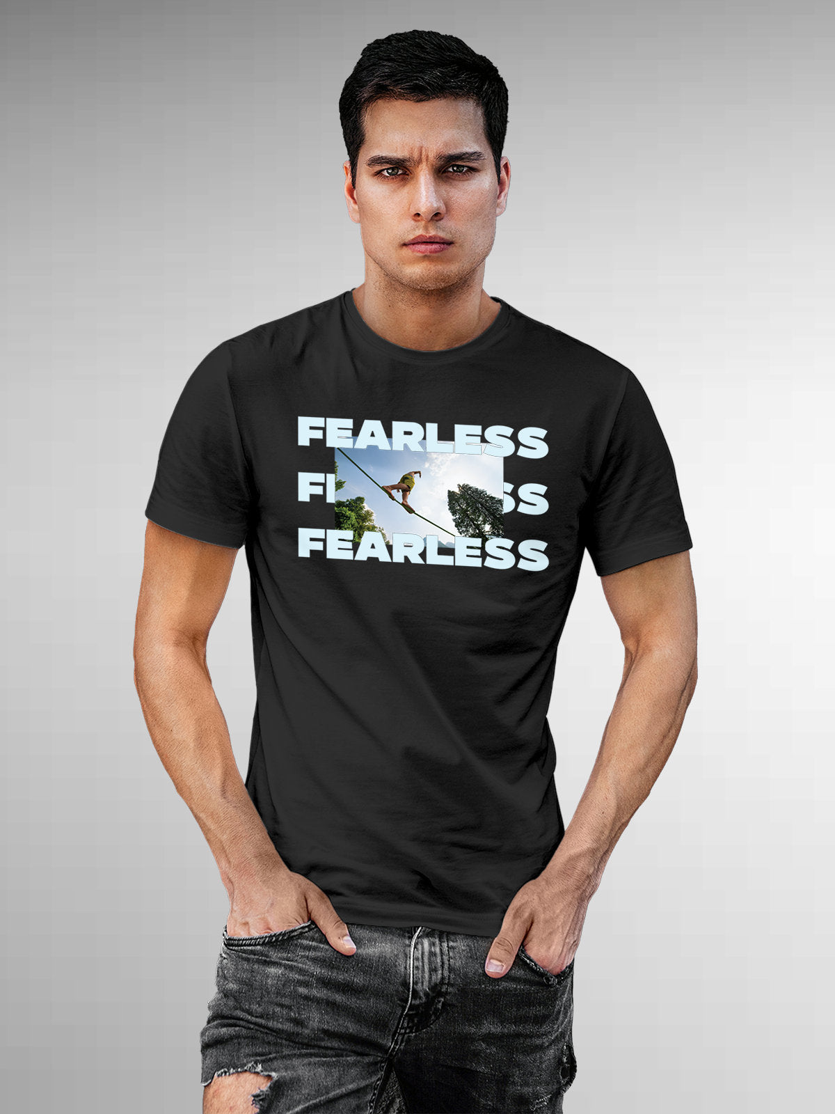 Model wearing Men's Dark Grey Round Neck T-shirt with 'Fearless' design, offering effortless style and premium comfort