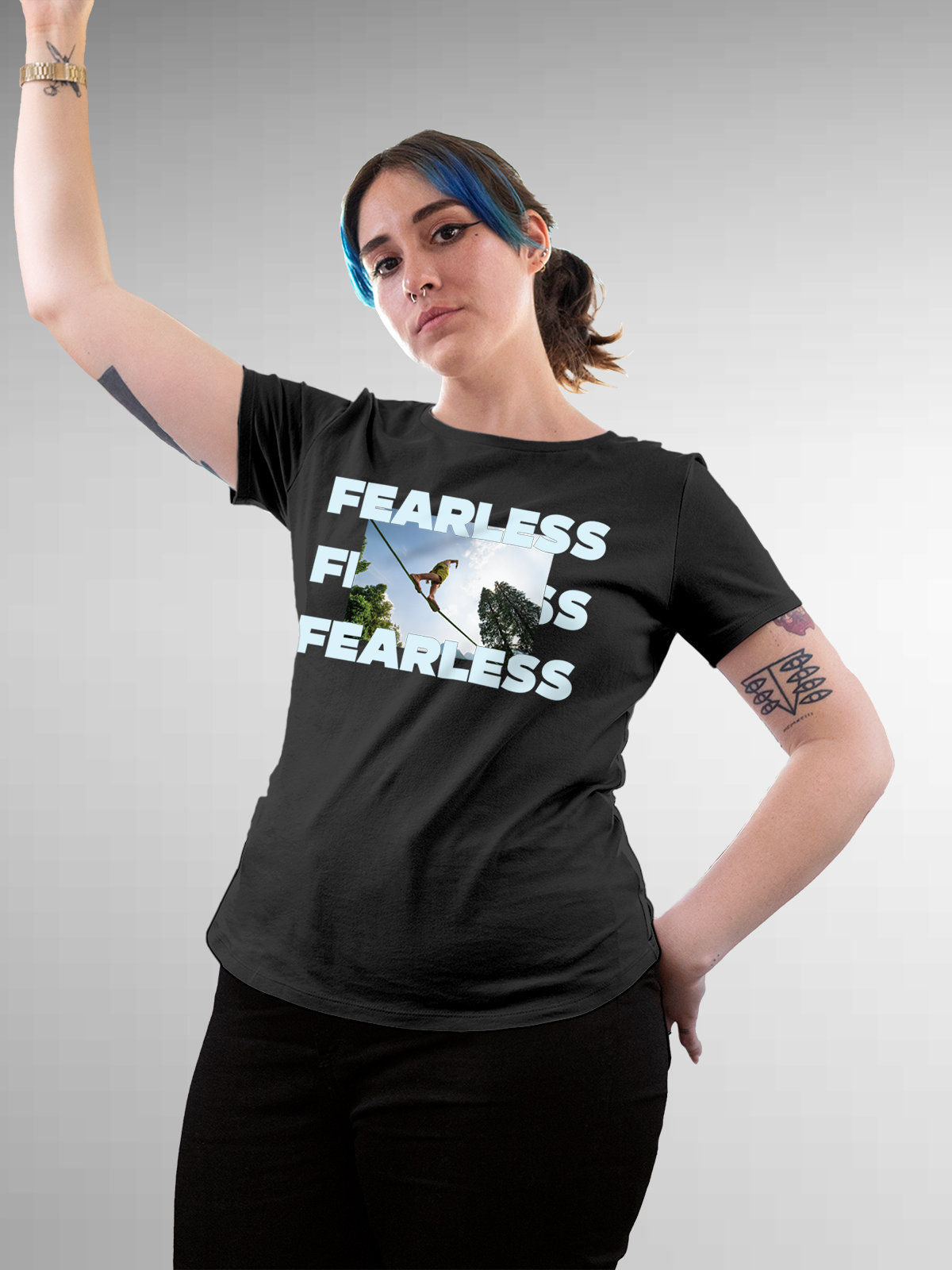 Model wearing Women's Dark Grey Round Neck T-shirt with 'Fearless' design, offering effortless style and premium comfort