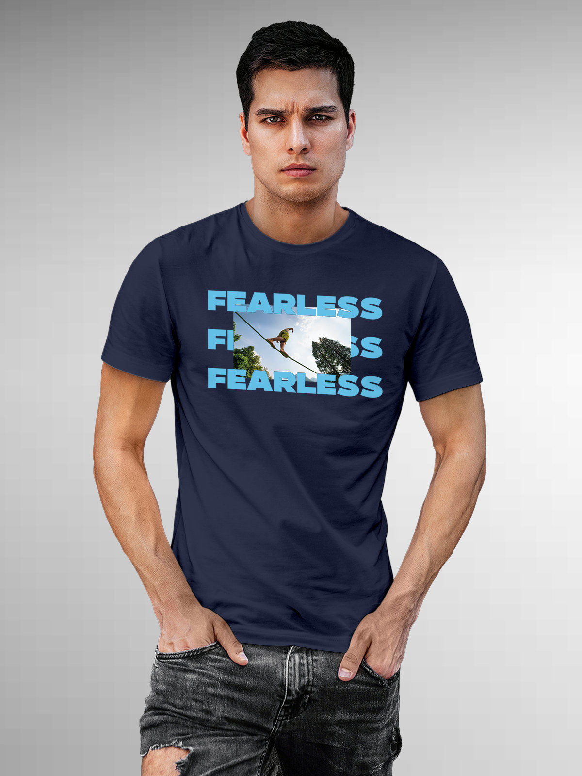 Model wearing Men's Navy Blue Round Neck T-shirt with 'Fearless' design, offering effortless style and premium comfort
