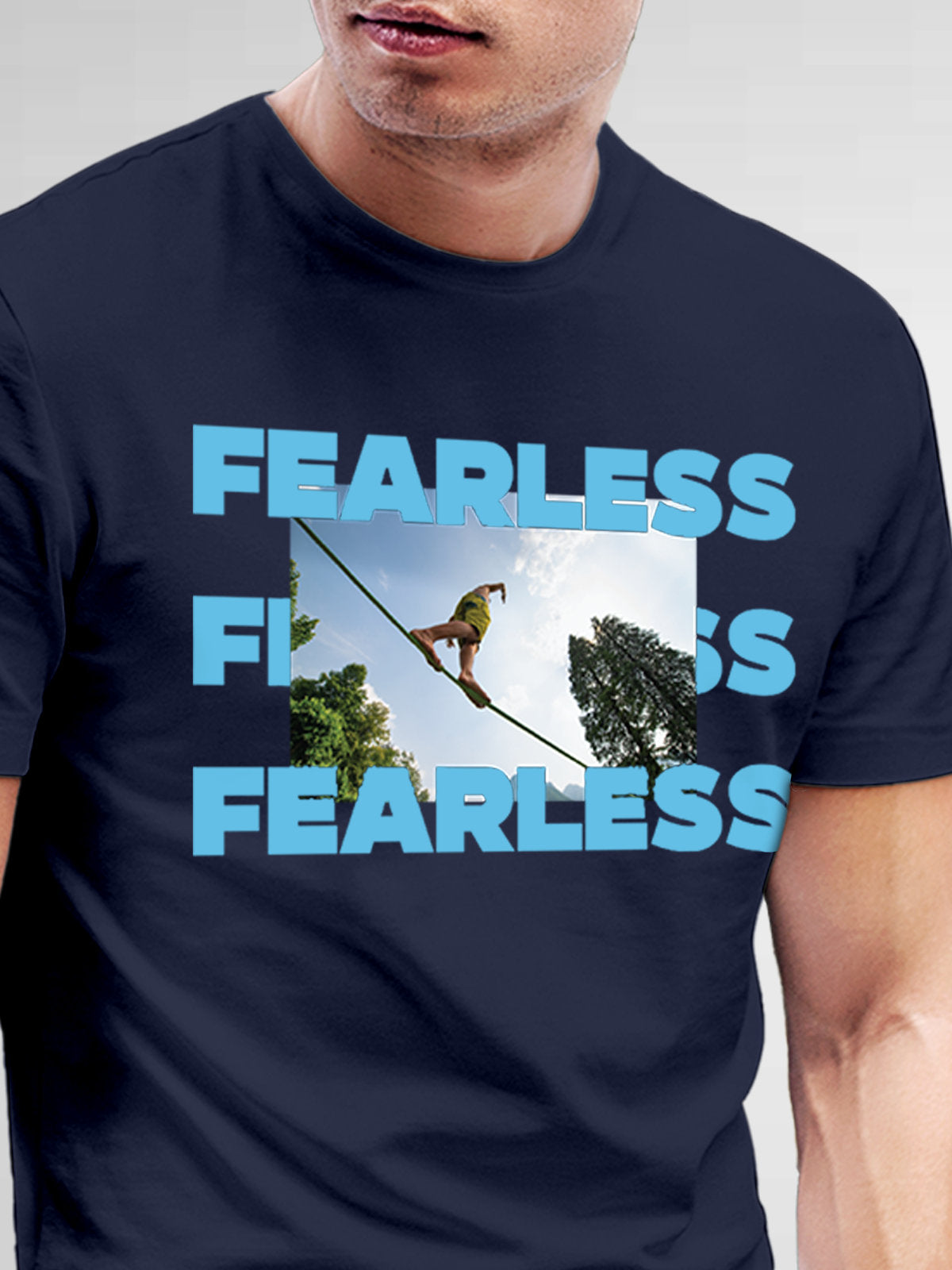 Close up of 'Fearless' design on Men's Navy Blue Round Neck T-shirt, highlighting intricate details and vibrant print.