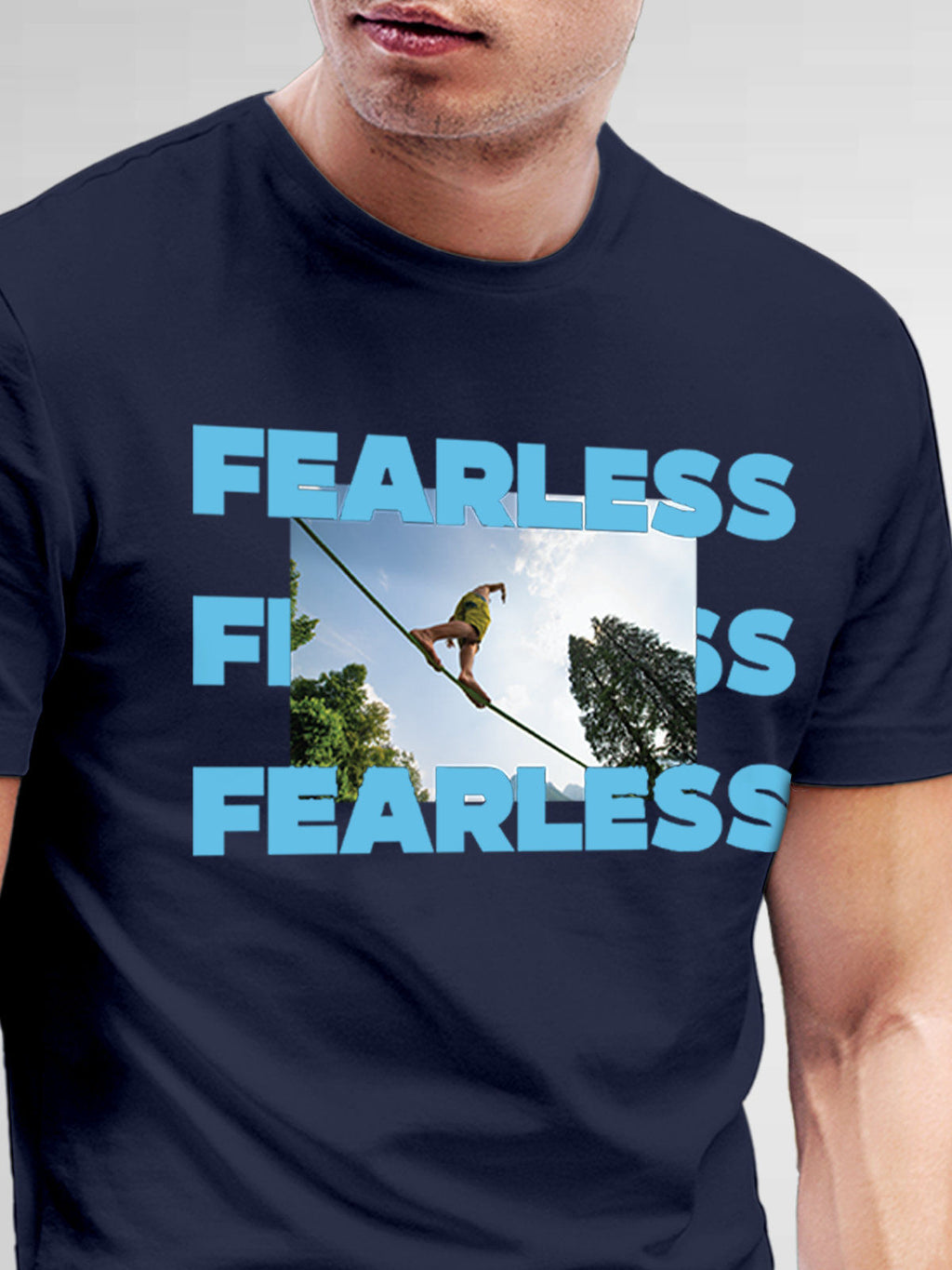 Close up of 'Fearless' design on Men's Navy Blue Round Neck T-shirt, highlighting intricate details and vibrant print.