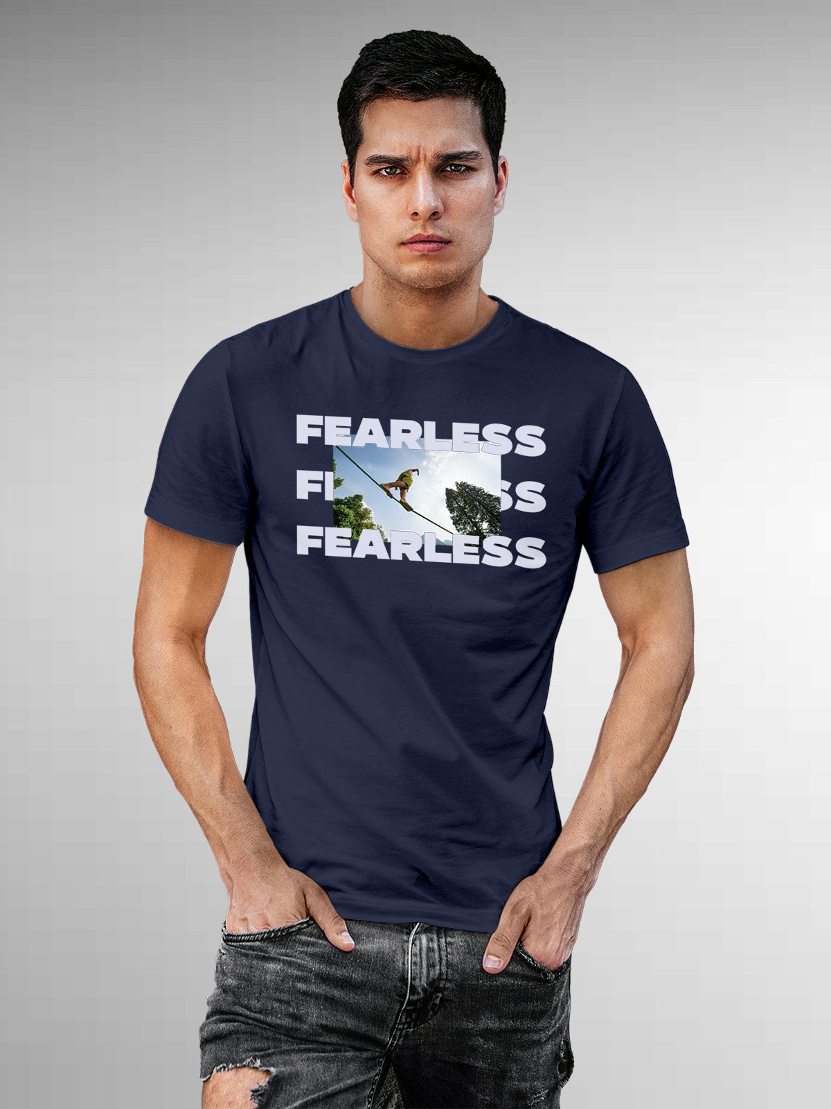 Model wearing Men's Navy Blue Round Neck T-shirt with 'Fearless' design, offering effortless style and premium comfort
