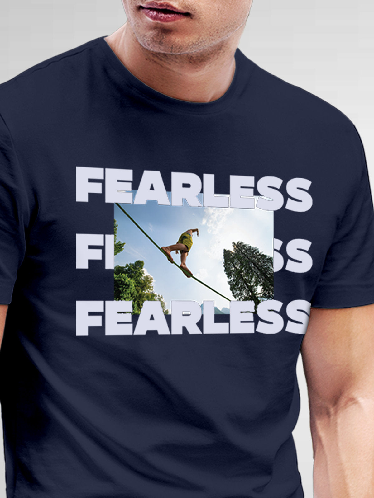 Close up of 'Fearless' design on Men's Navy Blue Round Neck T-shirt, highlighting intricate details and vibrant print.