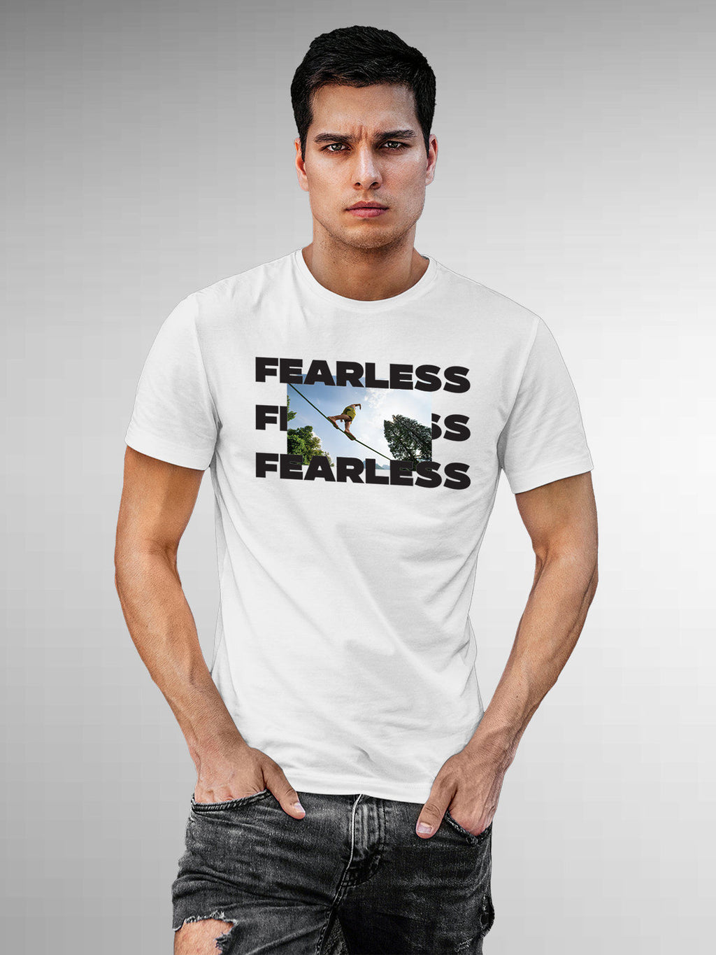 Model wearing Men's White Round Neck T-shirt with 'Fearless' design, offering effortless style and premium comfort
