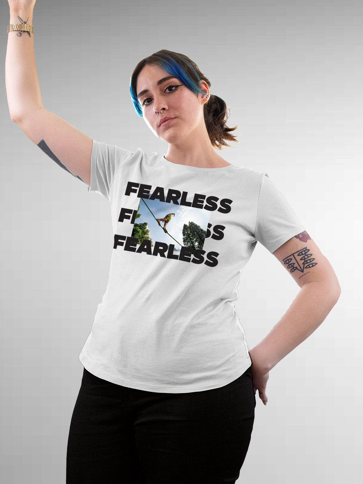 Model wearing Women's White Round Neck T-shirt with 'Fearless' design, offering effortless style and premium comfort