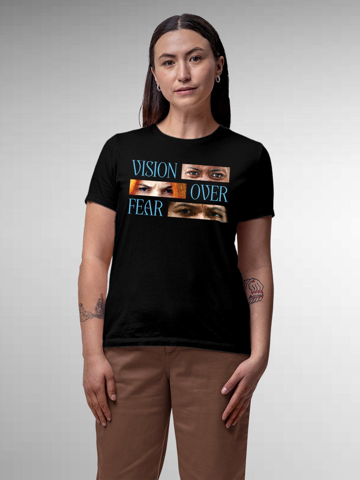 Model wearing Women's Black Round Neck T-shirt with 'Vision Over Fear' design, offering effortless style and premium comfort