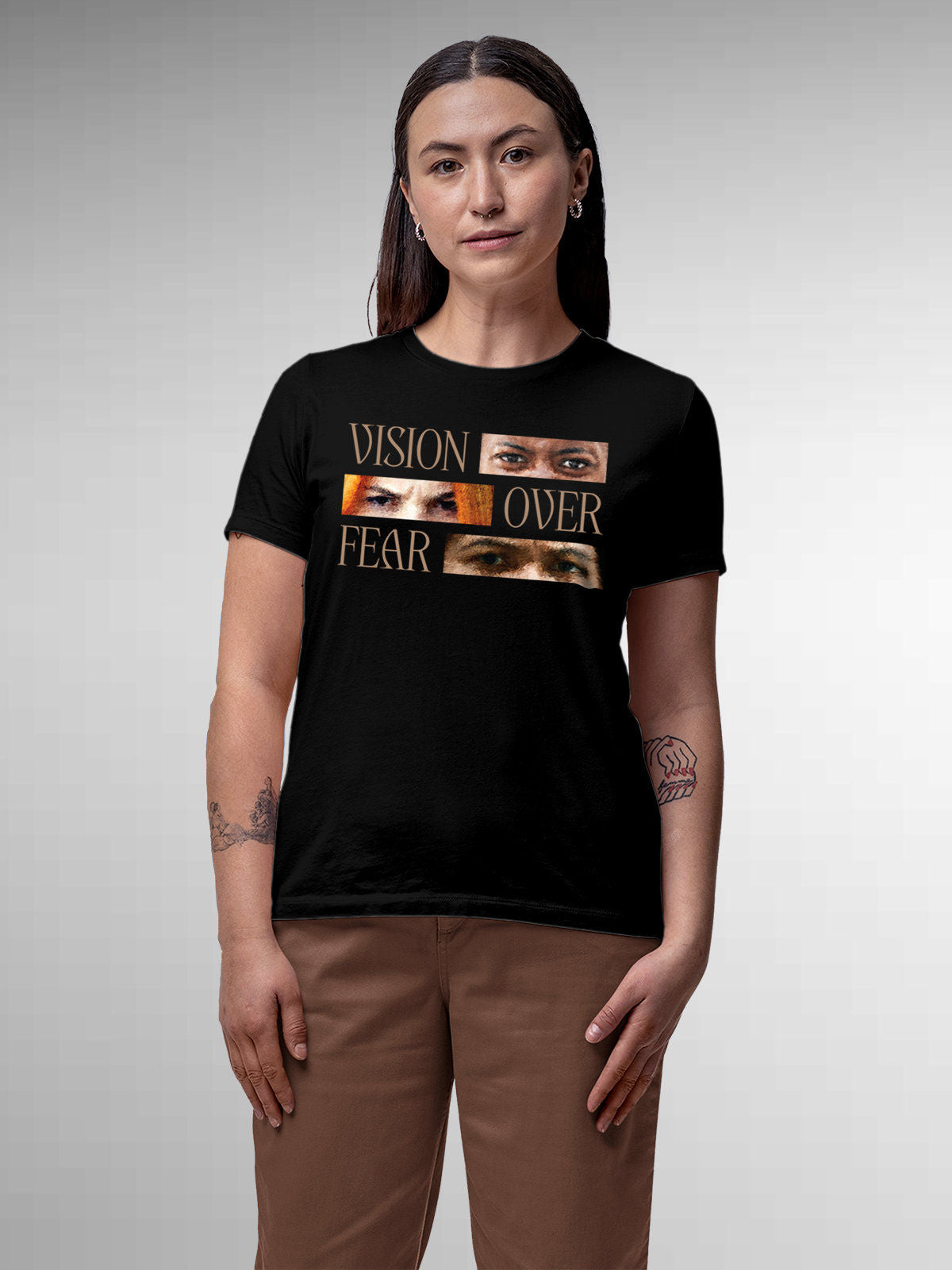 Model wearing Women's Black Round Neck T-shirt with 'Vision Over Fear' design, offering effortless style and premium comfort