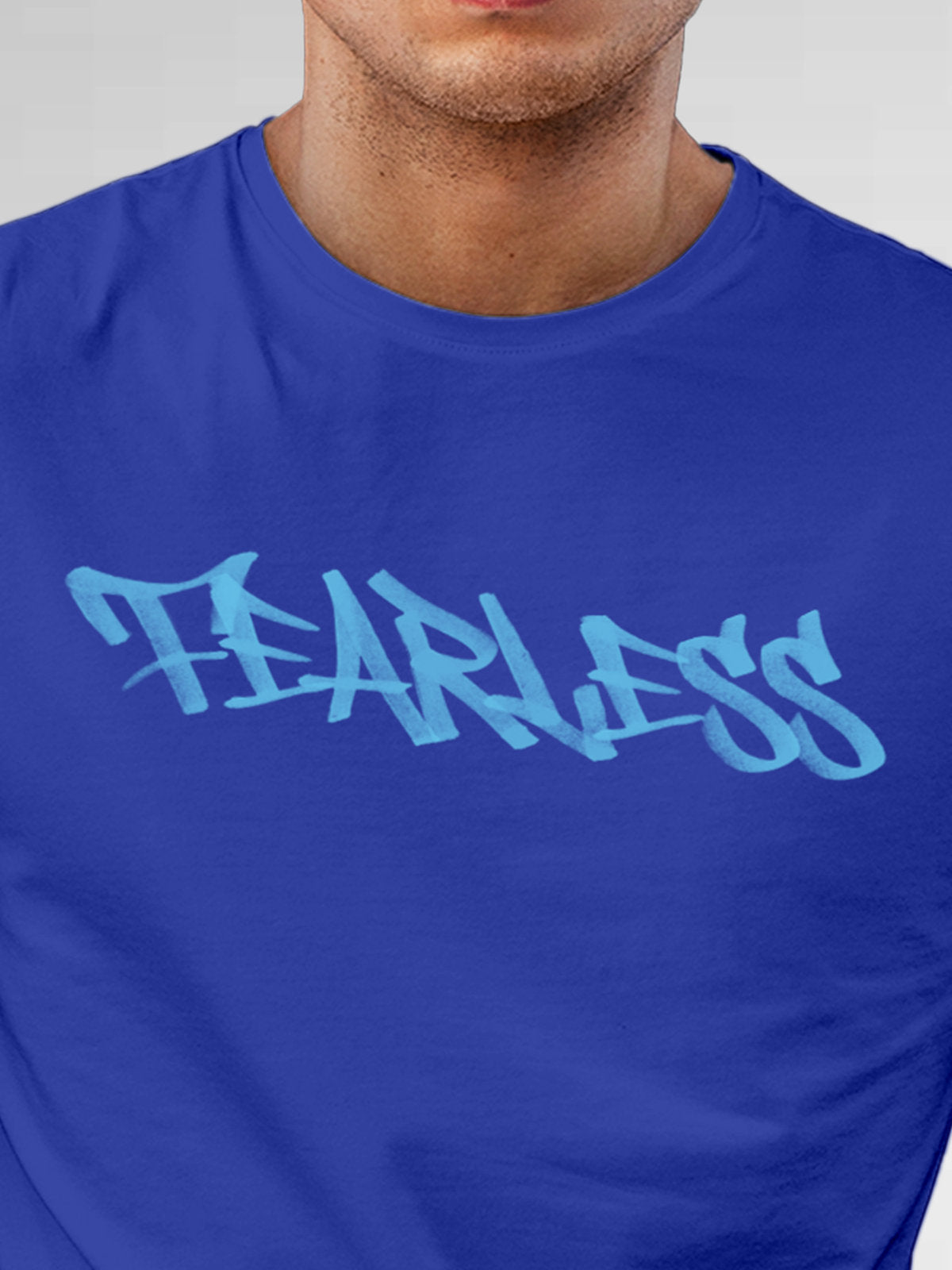 Close up of 'Fearless' design on Men's Blue Round Neck T-shirt, highlighting intricate details and vibrant print.